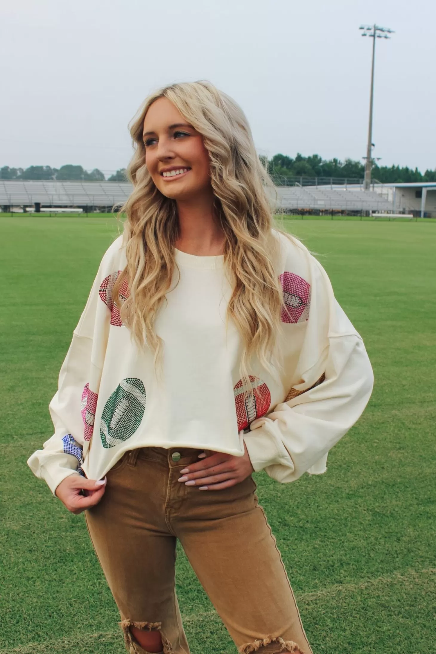 Allie Lynn's Boutique Printed Tops<Colorful Stone Football Crop Sweatshirt